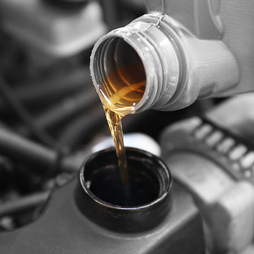 Pouring Oil Into Engine